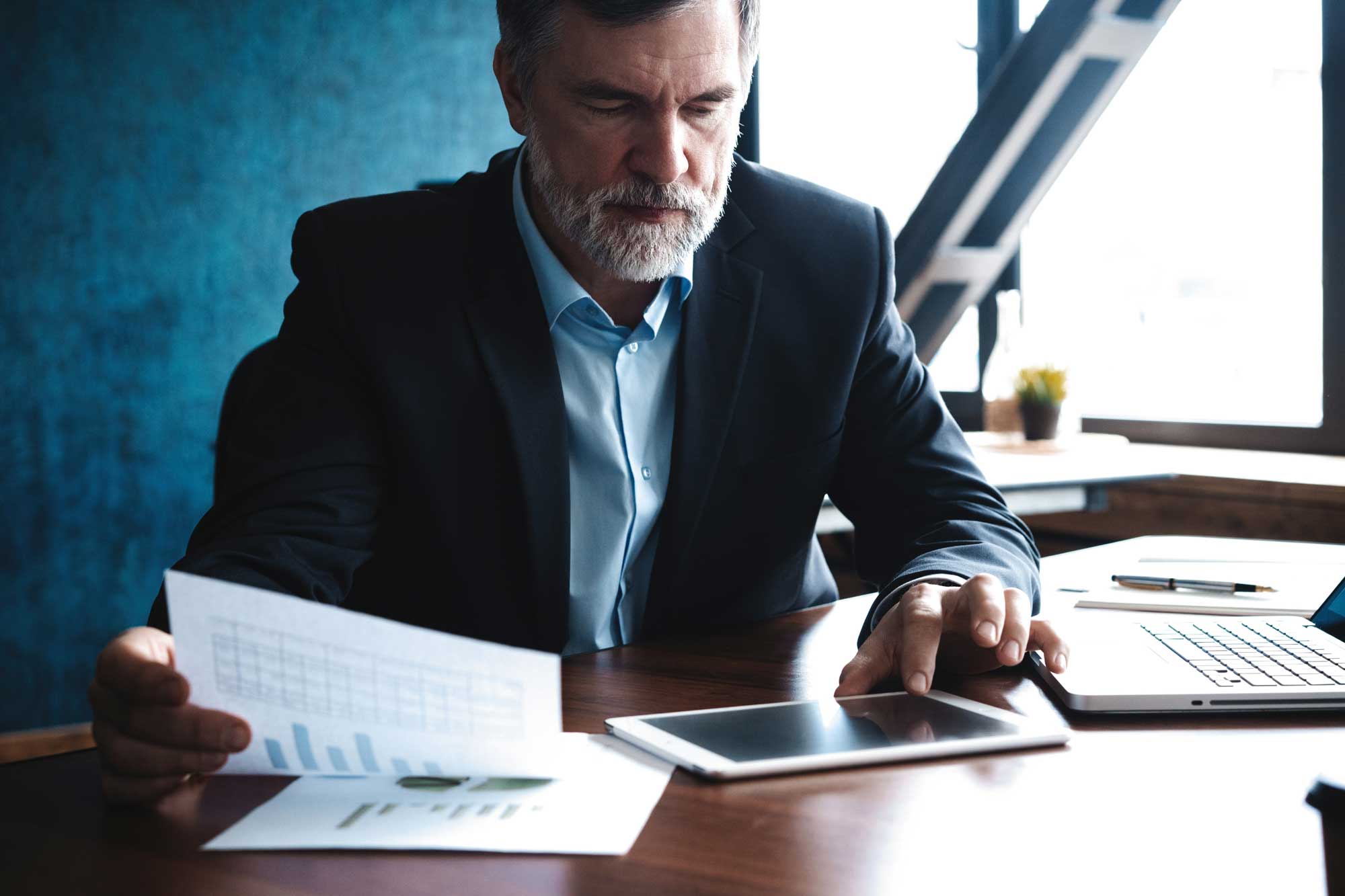 business-people-reviewing-paperwork-in-meeting