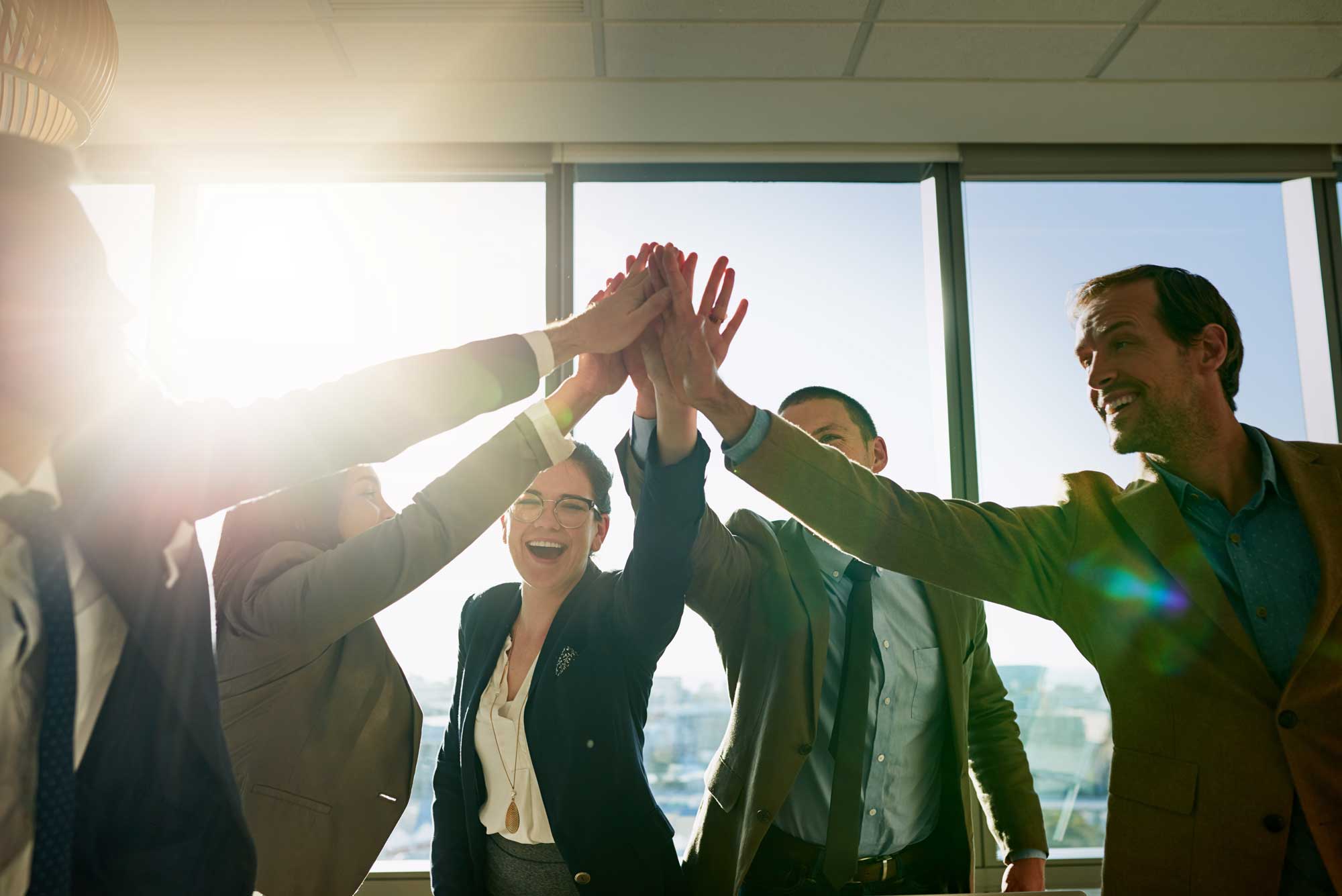 happy-business-people-and-high-five-with-team-for-collaboration