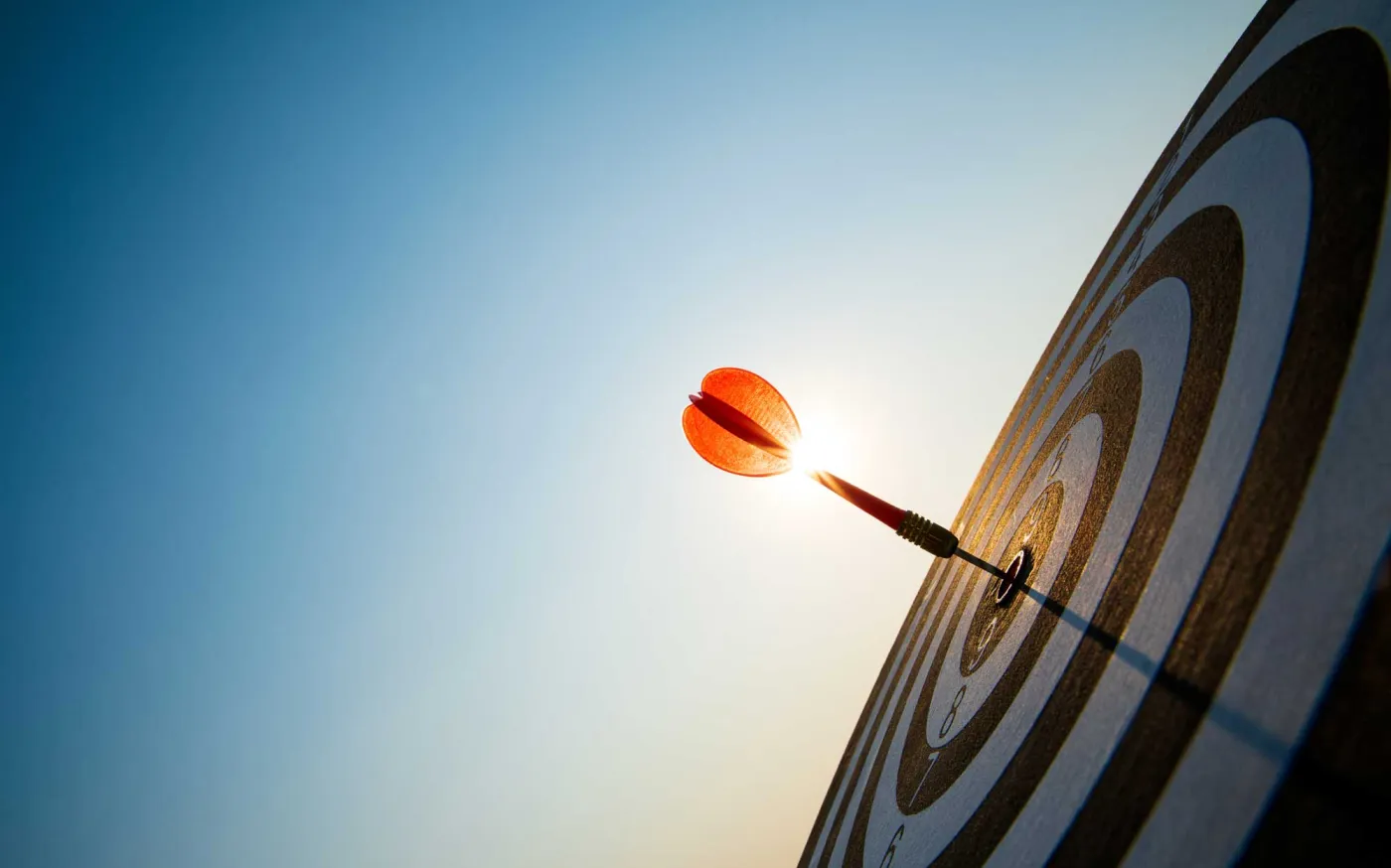 close up shot red darts arrow in the target